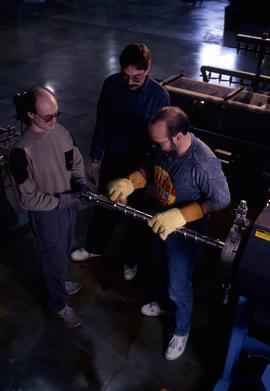 Photograph of students working with an equipment