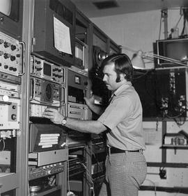 Photograph of Doug Roberts Operating the Main Console for the Audio/Video Distribution System in ...