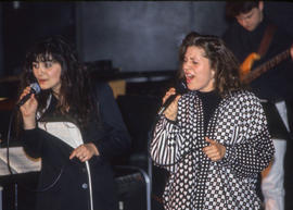 Photograph of two women singing together