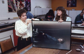 Photograph of Media Studies students working with oversized prints