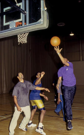 Photograph of a group of students playing basketball