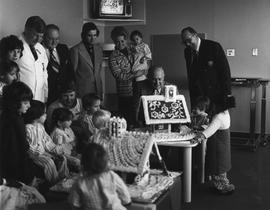 Photograph of Gordon Wragg, John Mason, and Igor Sukor Spending Time with the Children in the Ped...
