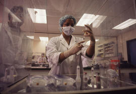 Photograph of a Pharmacy Assistant Student Preparing a Syringe