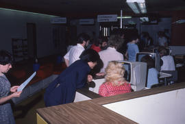 Photograph of staff testing the computer registration system