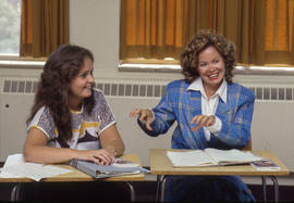 Photograph of students practicing sign language in class