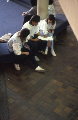 Photograph of students seated in the concourse