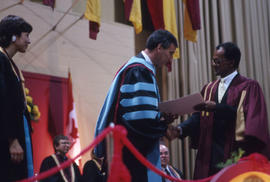 Photograph of President Robert Gordon and a graduate