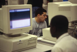 Photograph of two two students working on their drafting assignments