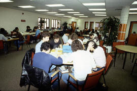 Photograph of Students Sitting in a Work Room