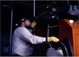 Photograph of student operating an equipment