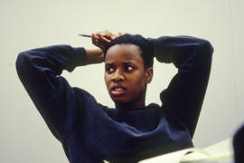A photograph of a student listening to a lecture in class