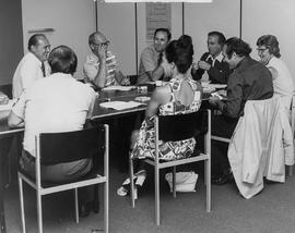 Photograph of Staff Members in a Meeting