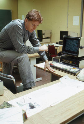 Photograph of a student reading some documents