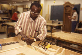 Photograph of a Student Making a Cabinet