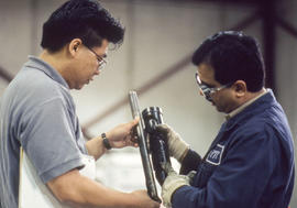 Photograph of an instructor explaining an equipment