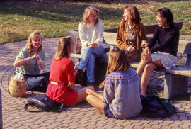Photograph of a group of friends on a bench in the Arboretum