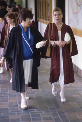 Photograph of the graduating class walking in the hallway to the convocation ceremony