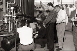 Photograph of a group of people in the refrigeration lab