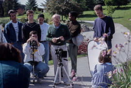 Photograph of faculty member Bert Hoferichter and students outdoors