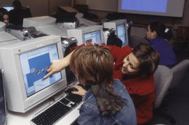 Photograph of students  in the journalism lab