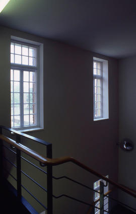 Photograph of the interior staircase in one of Lakeshore cottages