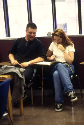 Photograph of Hospitality students reviewing their notes in the Bartending classroom