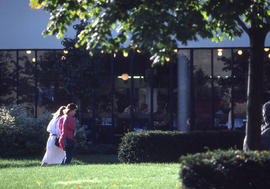 Photograph of people walking towards the building IE entrance