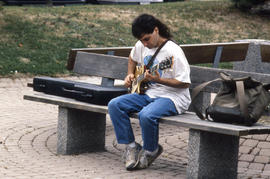 Photograph of a Music student playing guitar