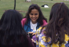 Photograph of Students Sitting on a Picnic Bench in the Arboretum