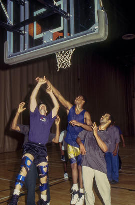 Photograph of students playing basketball