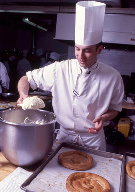 Photograph of a culinary student at work