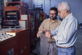Photograph of faculty member and student in the plastic centre