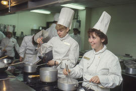 Photograph of students preparing food to serve in the Humber Room