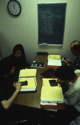 Photograph of a faculty member working with students