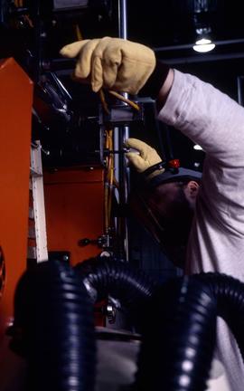 Photograph of a student operating an equipment at the Canadian Plastics Training Centre