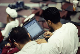 Photograph of a student using a laptop computer in the Lecture Theatre