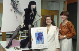 Photograph of Retail Co-op program students dressing a mannequin for a window display