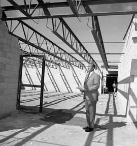 Photograph of Jim Davison viewing the Queensway campus expansion