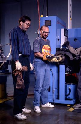 Photograph of students operating an equipment