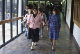 Photograph of staff members walking in the hallway