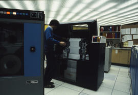 Photograph of computer operator Ron Graham in the computer room