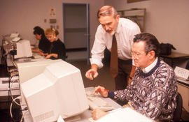 Photograph of Jim Hardy working with an adult learner