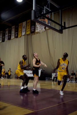 Photograph of the Humber Hawks boys' basketball team in play
