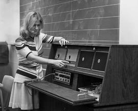 Photograph of Grace Allen Listening to Audio from a Radiogram