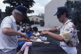 Photograph of a staff BBQ on the back patio outside the greenhouse