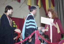 Photograph of graduate receiving diploma