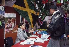 Photograph of a student visiting an information booth on Jamaica