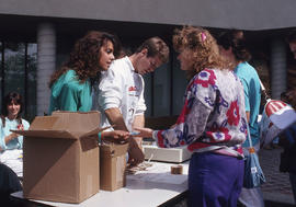 Photograph of persons selling tickets