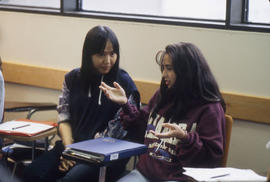 Photograph of a Group of Students Talking in Class