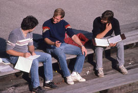 Photograph of students conversing outside of the bleachers
